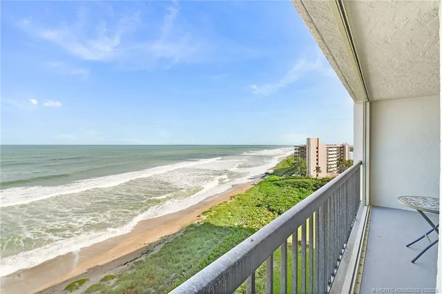 a bathroom with a granite countertop sink a toilet a shower and a mirror