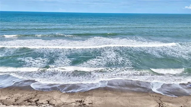 a view of a hallway with washer and dryer