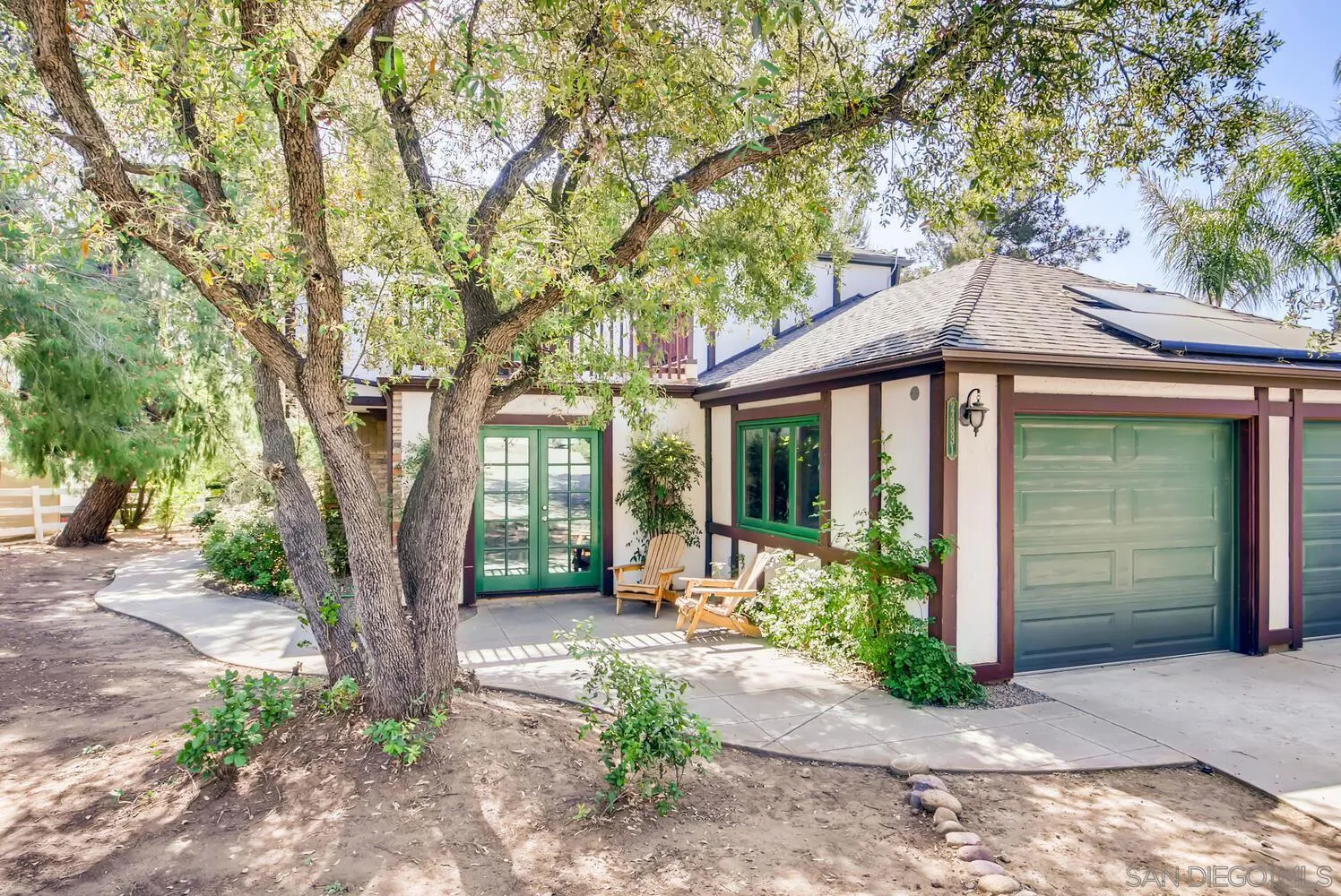 24331 Del Amo Road Ramona, CA 92065 - Photo 1 of 28 a front view of a house with garden