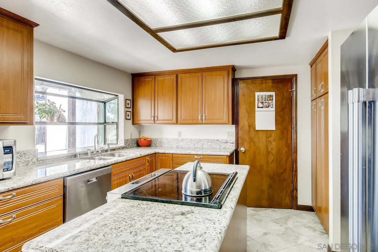 24331 Del Amo Road Ramona, CA 92065 - Photo 8 of 28 a kitchen with stainless steel appliances granite countertop a sink stove and refrigerator