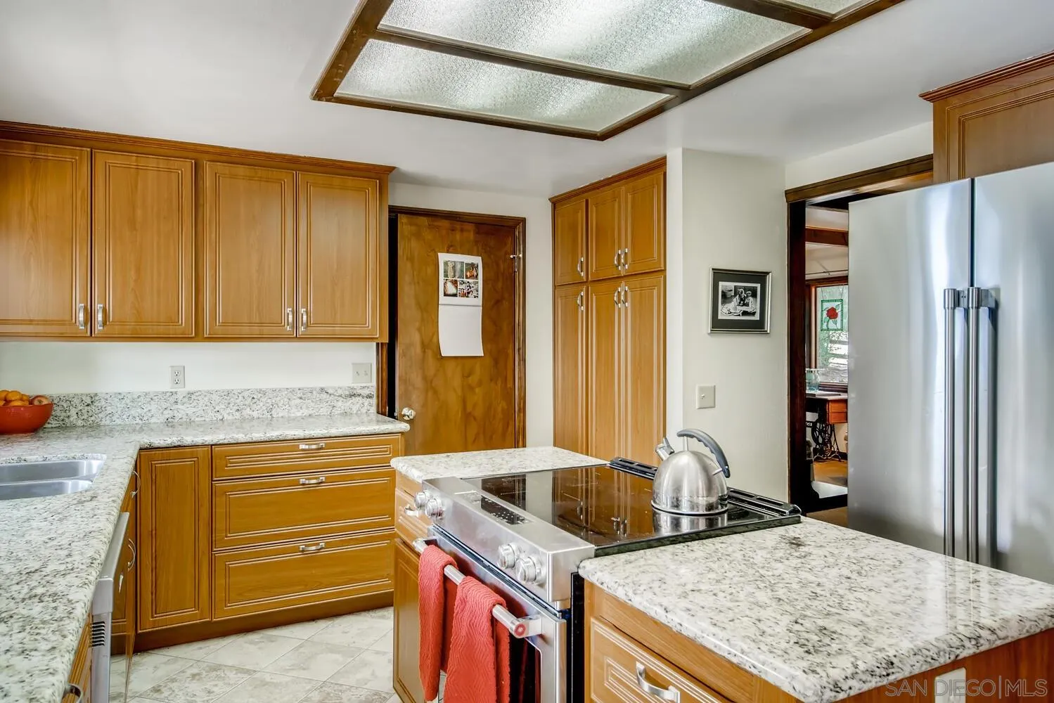 24331 Del Amo Road Ramona, CA 92065 - Photo 9 of 28 a kitchen that has a cabinets and a stove