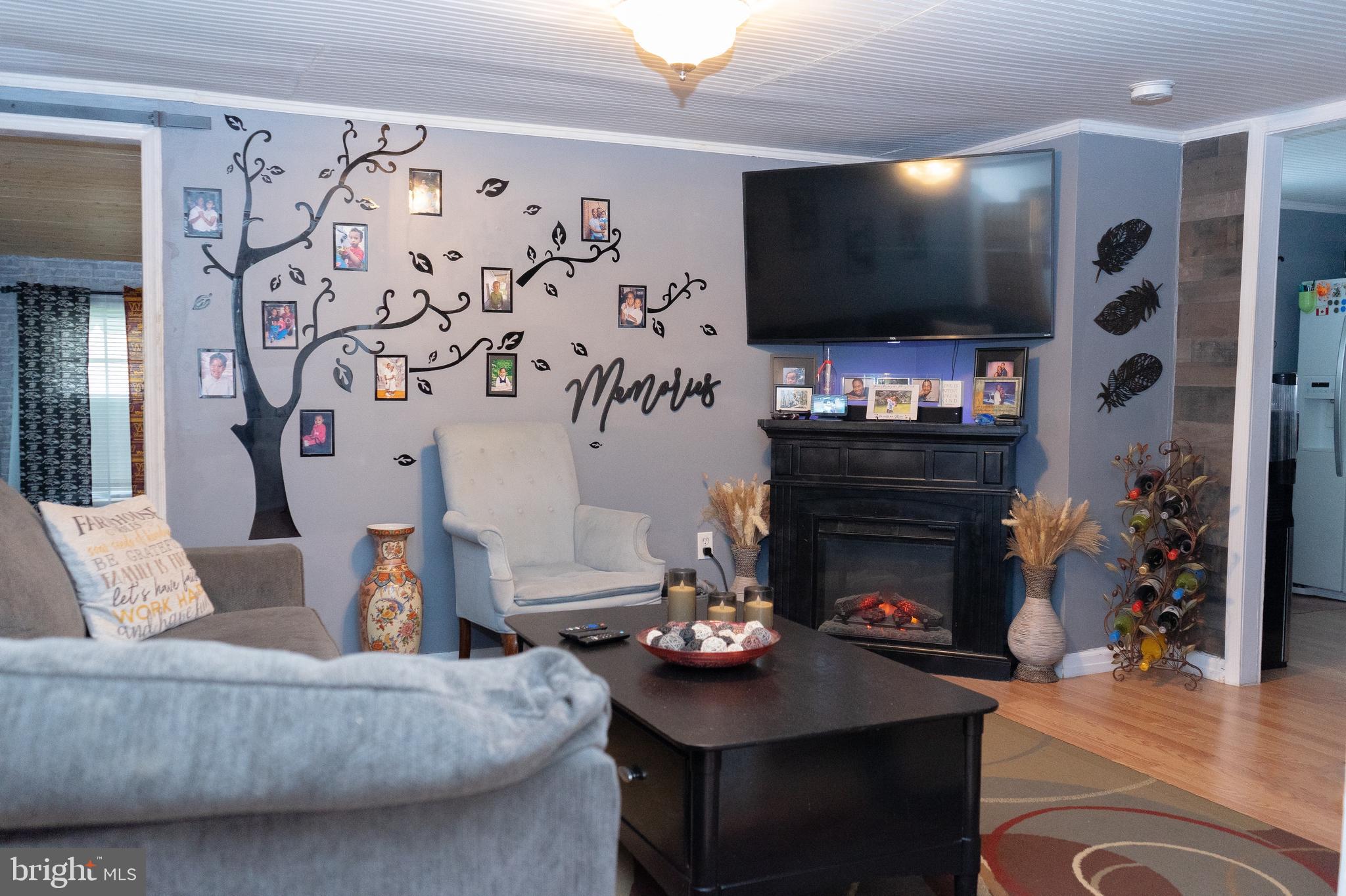 112 Trailway Road Middle River, MD 21220 - Photo 13 of 32 a living room with furniture and a flat screen tv