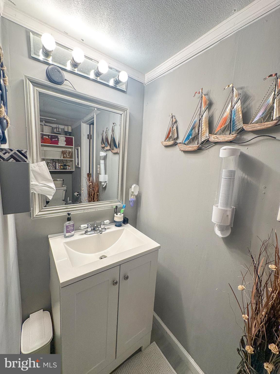 112 Trailway Road Middle River, MD 21220 - Photo 27 of 32 a bathroom with a sink and a mirror