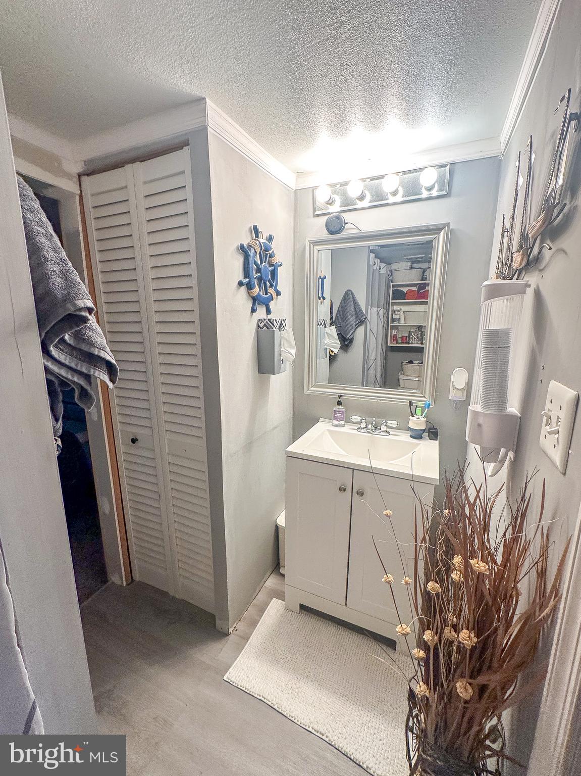 112 Trailway Road Middle River, MD 21220 - Photo 28 of 32 a bathroom with a sink a mirror and shower view