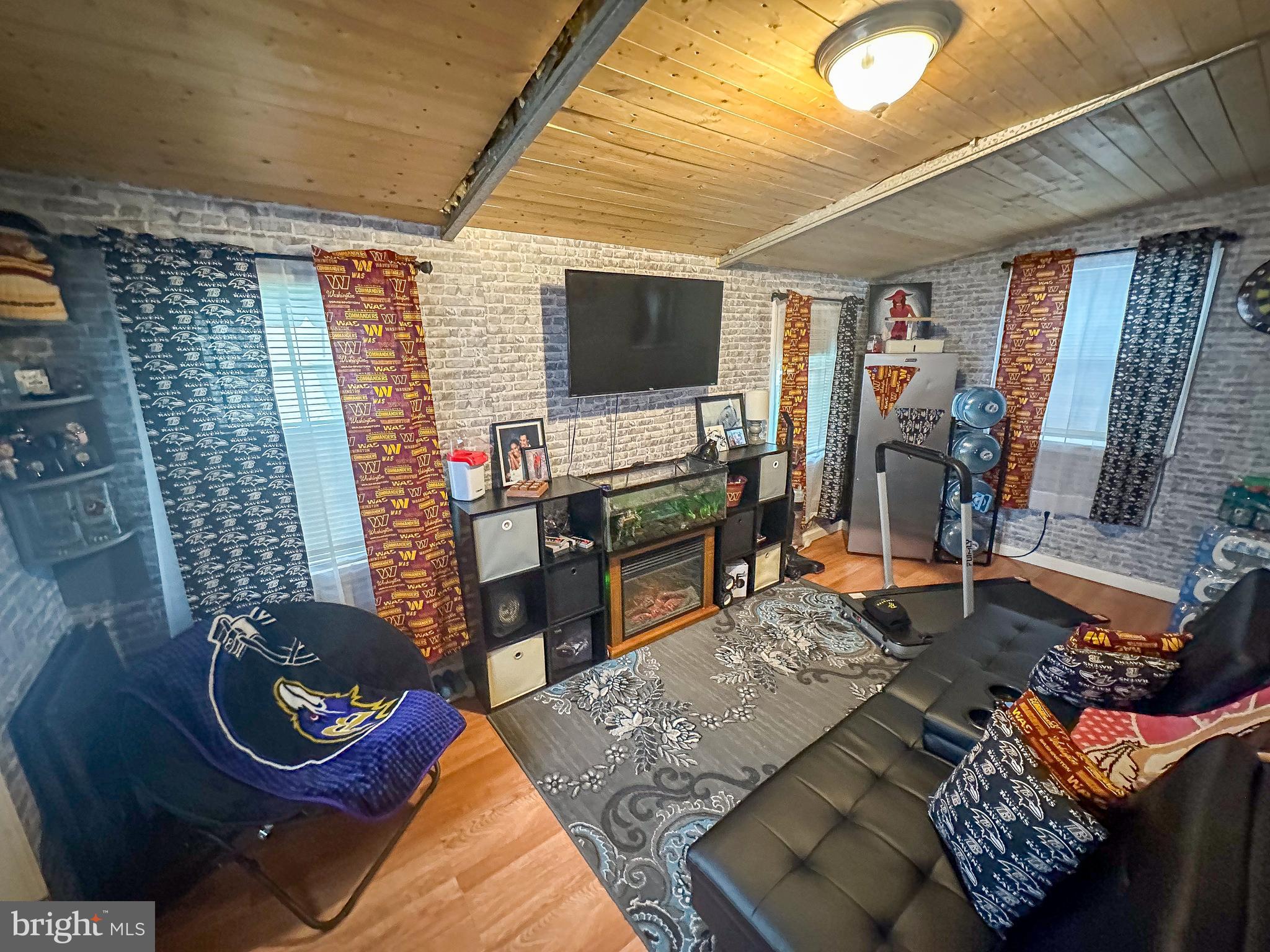112 Trailway Road Middle River, MD 21220 - Photo 30 of 32 a living room with furniture and a flat screen tv