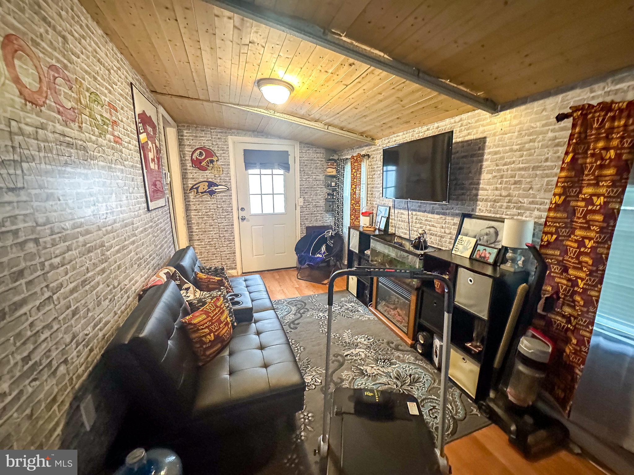 112 Trailway Road Middle River, MD 21220 - Photo 32 of 32 a view of a livingroom with furniture and a flat screen tv