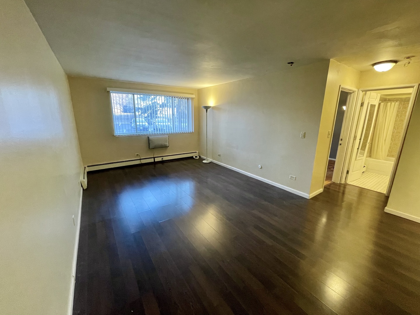 Undisclosed Address Palatine, IL 60074 - Photo 3 of 6 an empty room with wooden floor and windows