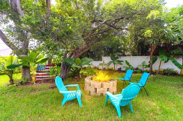 a backyard of a house with seating space