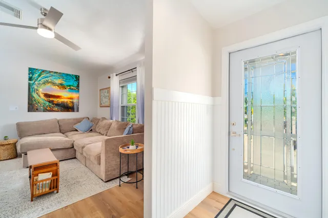 a bedroom with a bed and a flat screen tv in it