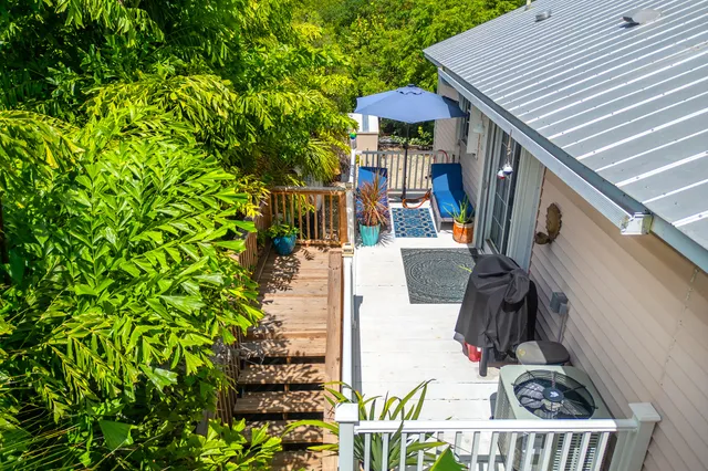 an aerial view of a house with a yard and garden