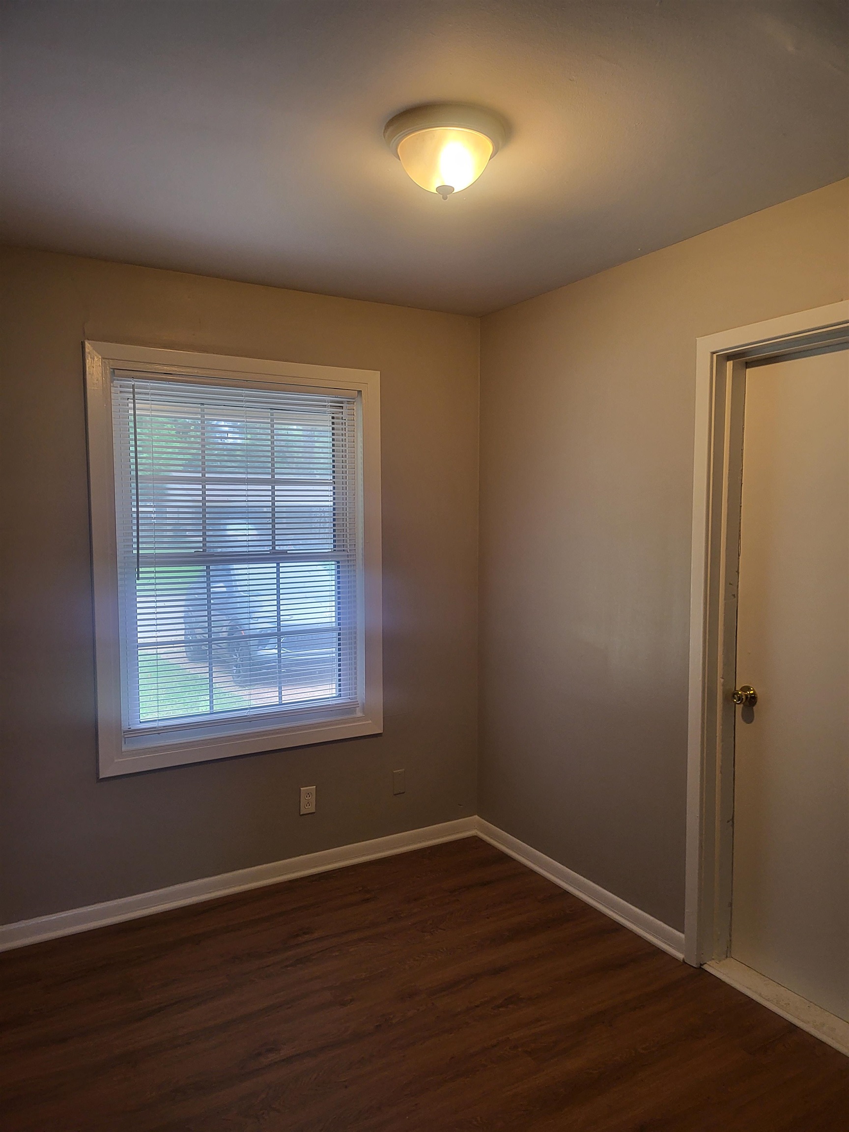 1769 Capri Street Memphis, TN 38117 - Photo 5 of 19 Empty room with baseboards and dark wood finished floors