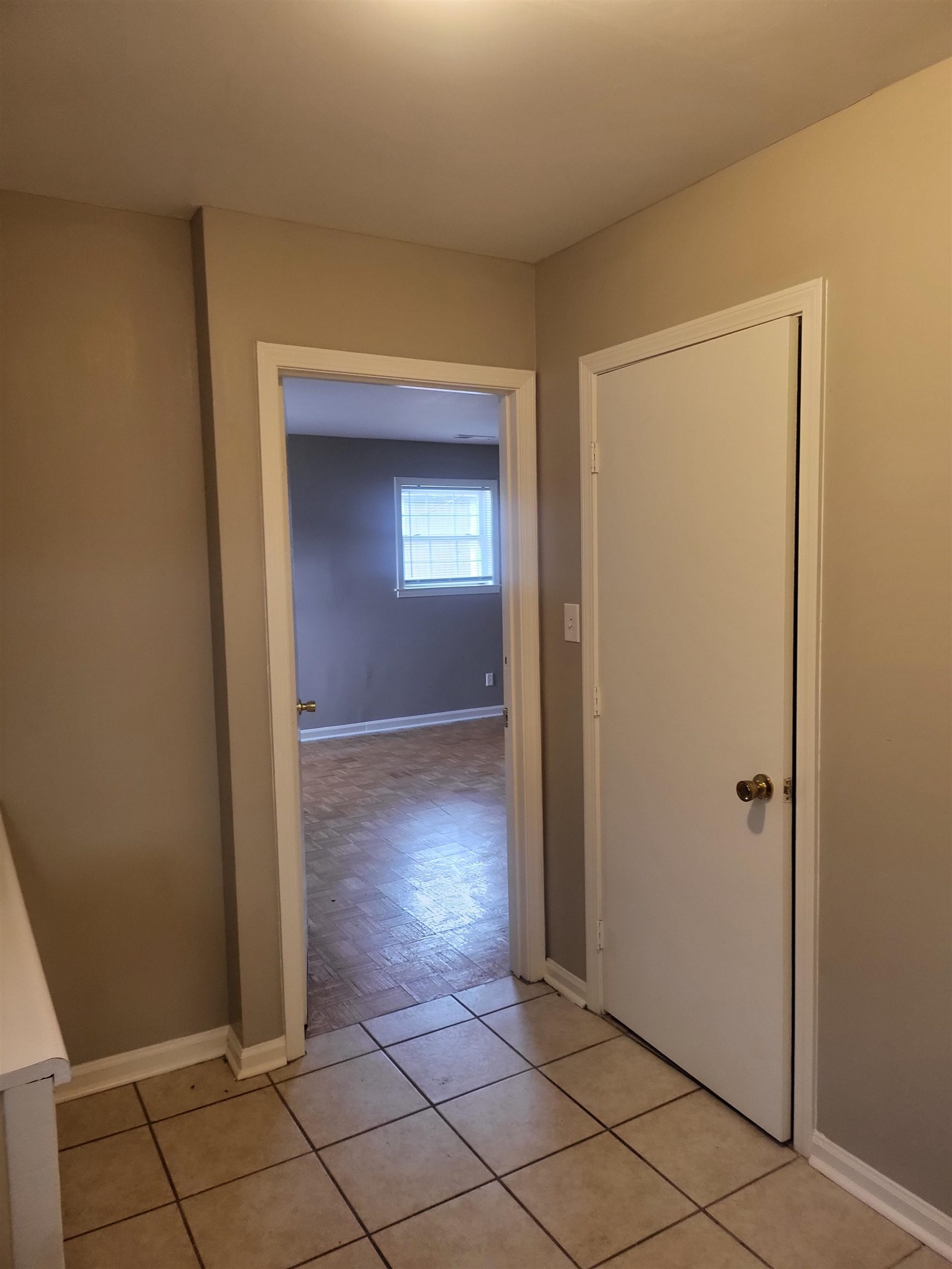 1769 Capri Street Memphis, TN 38117 - Photo 7 of 19 Corridor with baseboards and light tile patterned floors