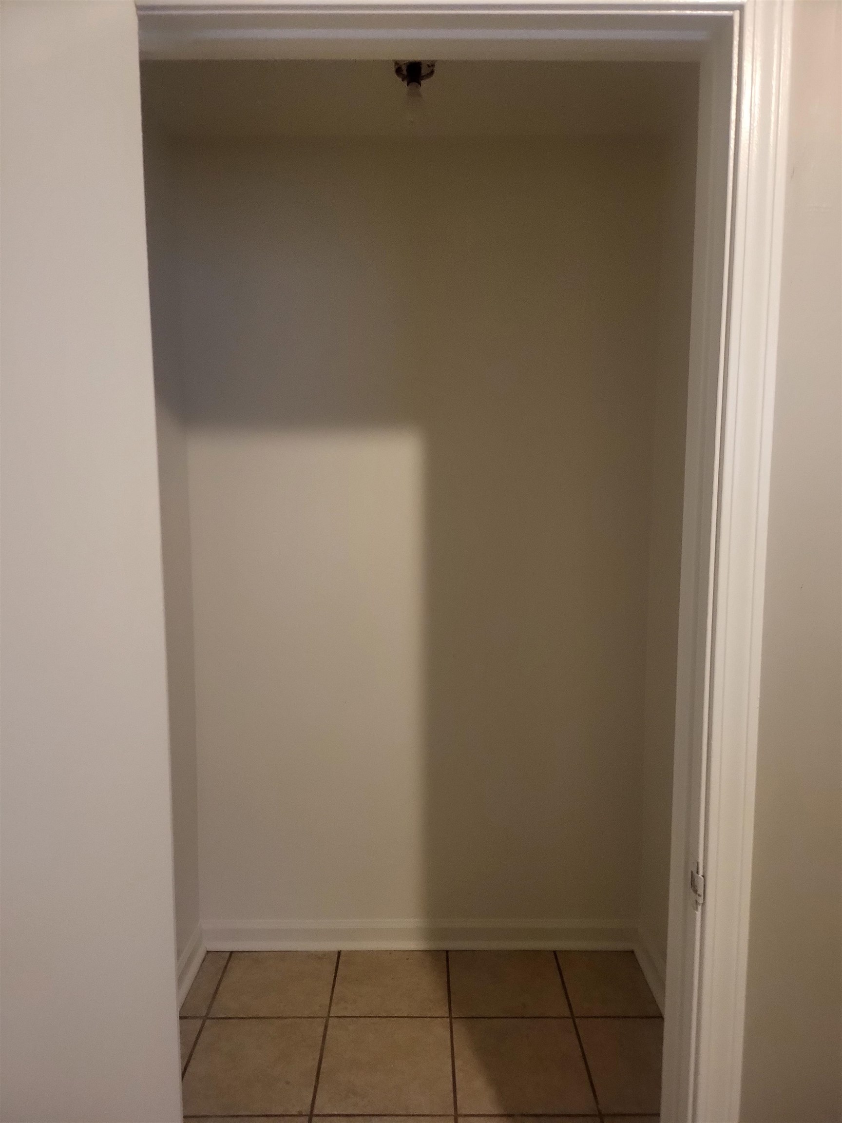 1769 Capri Street Memphis, TN 38117 - Photo 8 of 19 Hallway with baseboards and light tile patterned floors