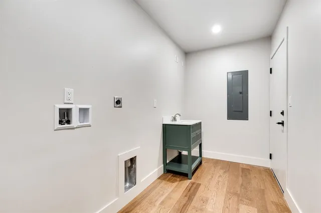 a view of kitchen with sink and a refrigerator
