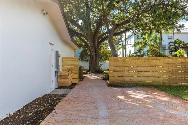 a view of a pathway with a yard