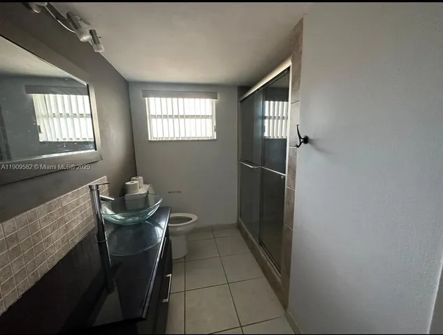 a view of a livingroom with furniture and windows