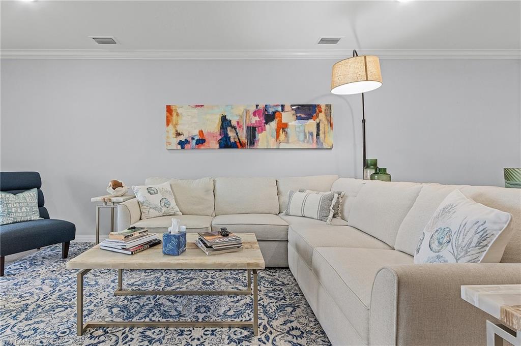14618 Edgewater Circle Naples, FL 34114 - Photo 13 of 30 Living room with ornamental molding