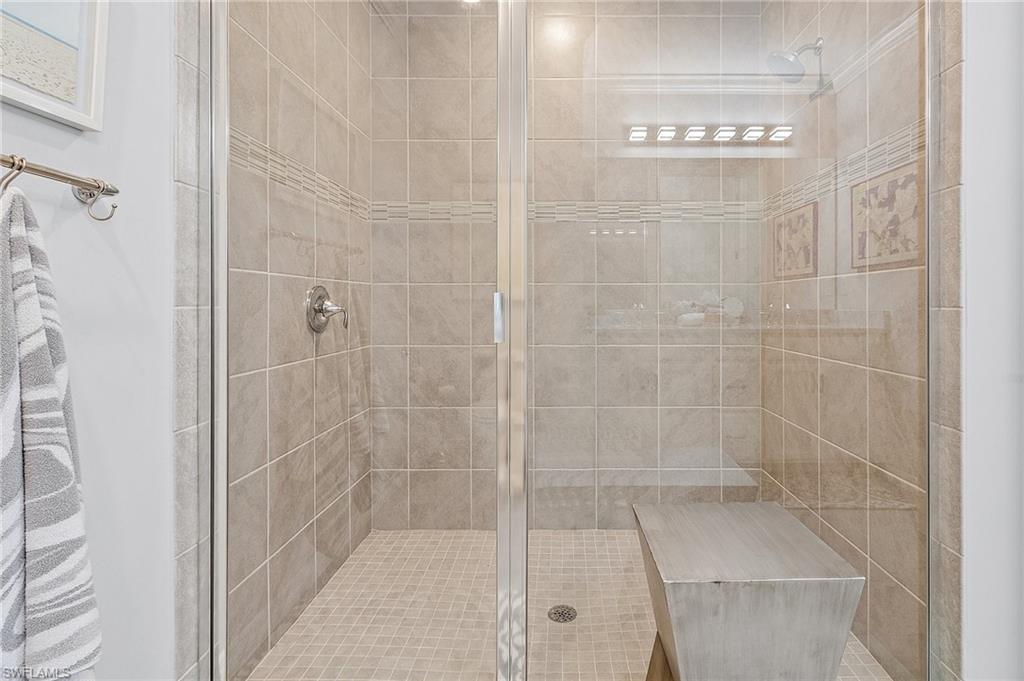 14618 Edgewater Circle Naples, FL 34114 - Photo 22 of 30 Bathroom featuring a shower with door