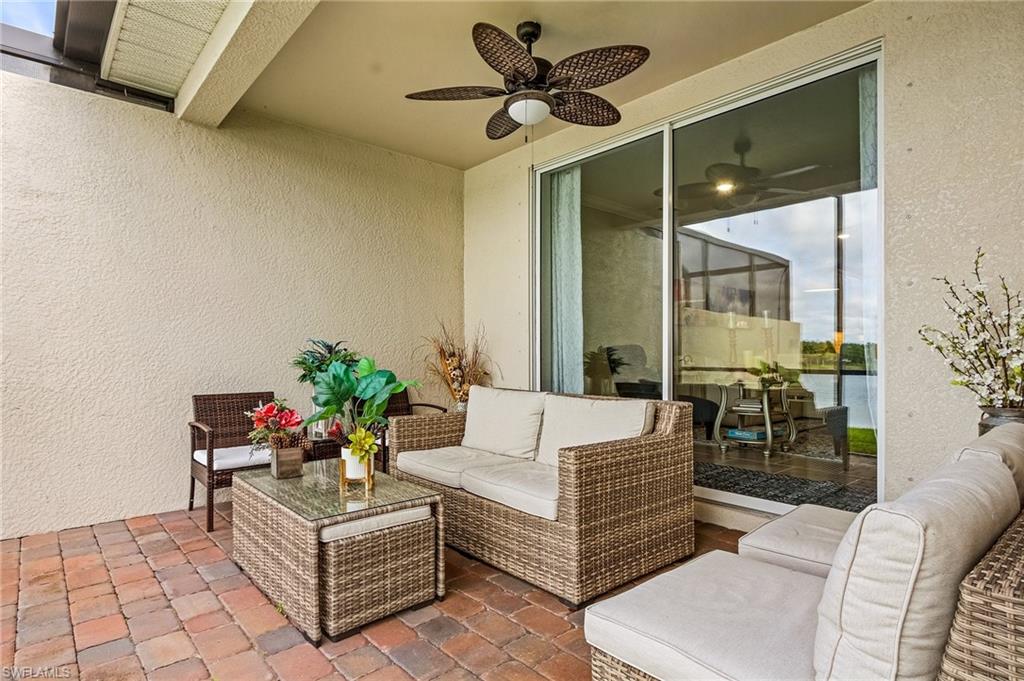 14618 Edgewater Circle Naples, FL 34114 - Photo 26 of 30 View of patio / terrace with ceiling fan and an outdoor hangout area