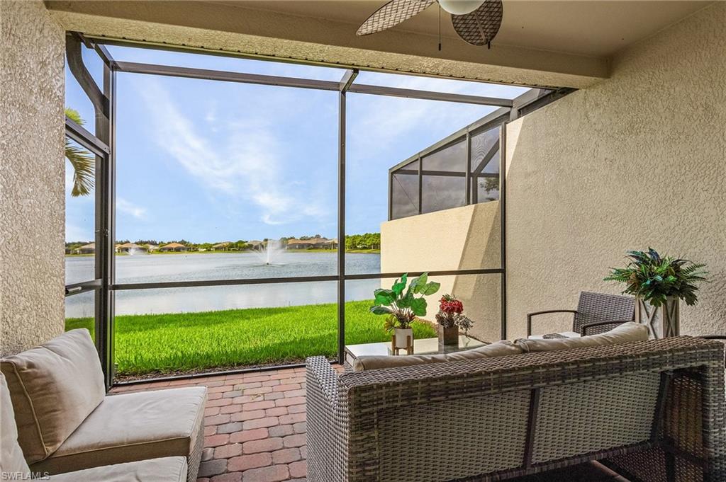 14618 Edgewater Circle Naples, FL 34114 - Photo 27 of 30 Sunroom / solarium with ceiling fan and a water view