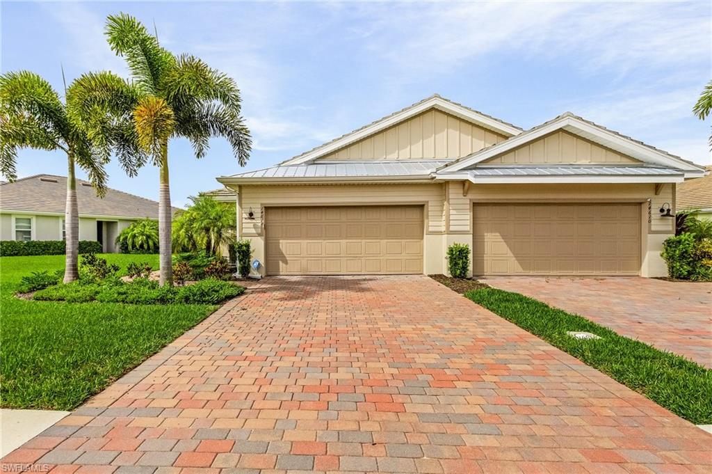 14618 Edgewater Circle Naples, FL 34114 - Photo 3 of 30 View of front of property with a garage
