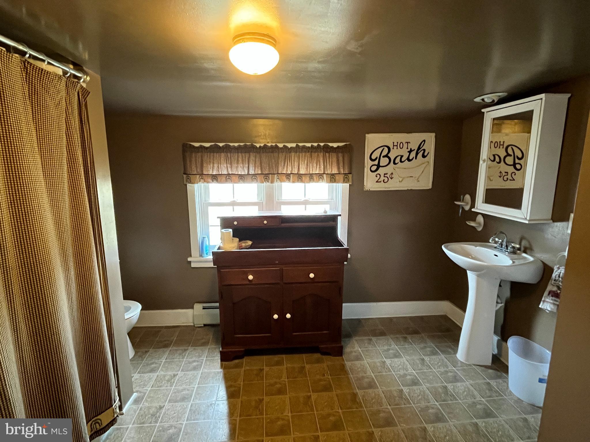 2 West High Street McClure, PA 17841 - Photo 24 of 40 a bathroom with a sink a toilet and mirror