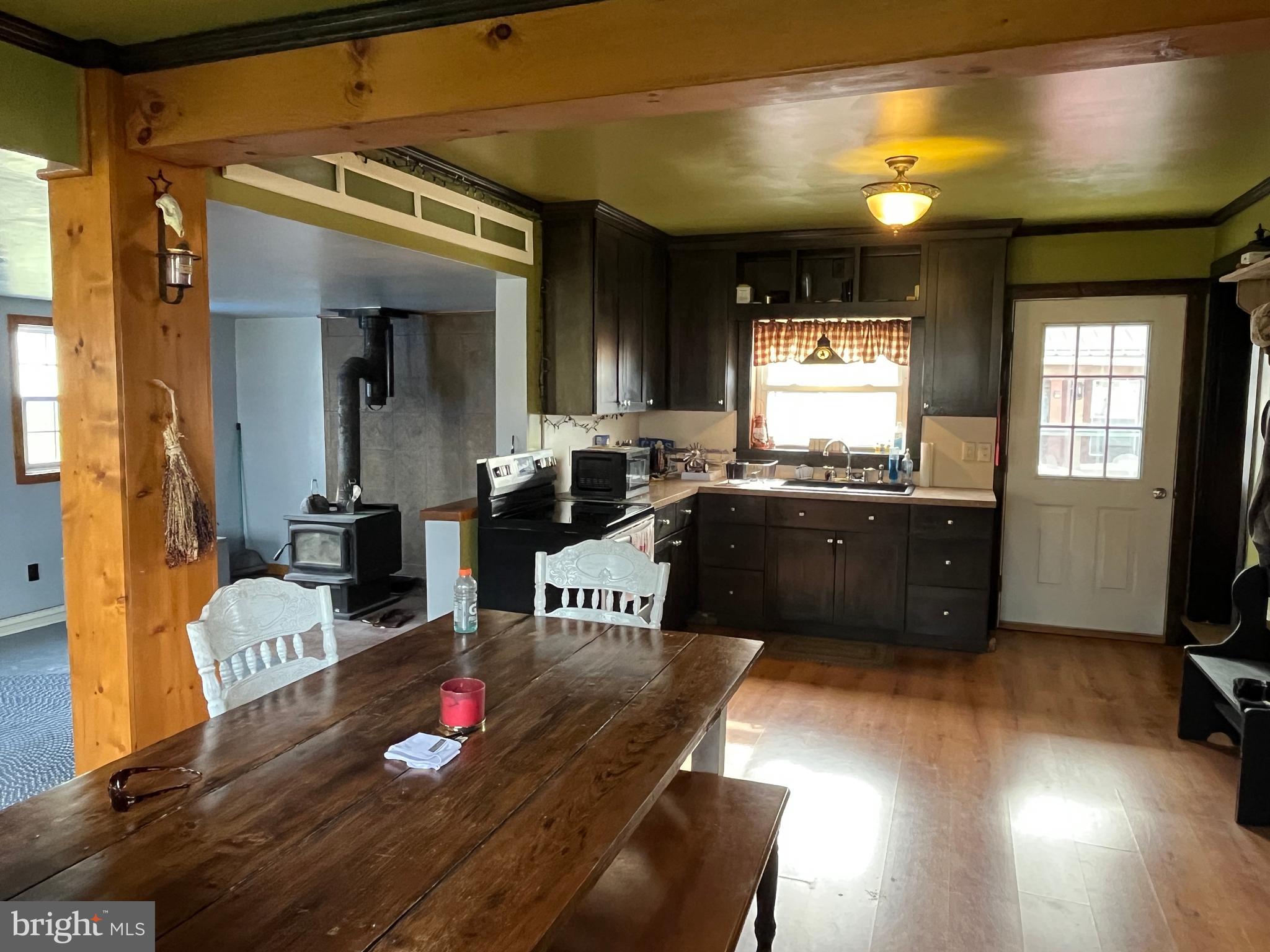 2 West High Street McClure, PA 17841 - Photo 8 of 40 a living room with furniture and a flat screen tv