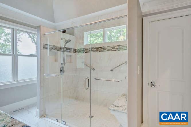 2474 Summit Ridge Trail Charlottesville, VA 22911 - Photo 11 of 16 a bathroom with a glass shower door