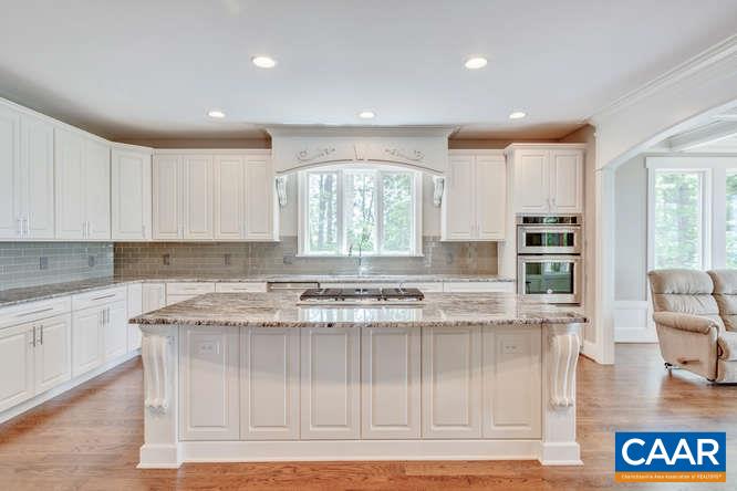 2474 Summit Ridge Trail Charlottesville, VA 22911 - Photo 6 of 16 a kitchen with a stove a sink a refrigerator and cabinets