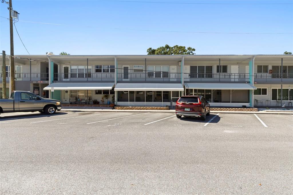4152 55th Way North, Unit 927 Kenneth City, FL 33709 - Photo 1 of 1 a car parked in front of a building