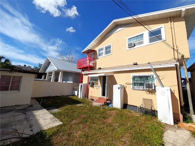 a view of a white house with a large windows