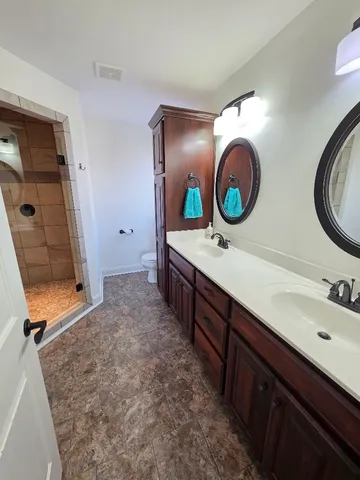 a view of a livingroom with furniture and a flat screen tv