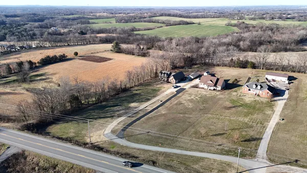 an aerial view of a house with outdoor space
