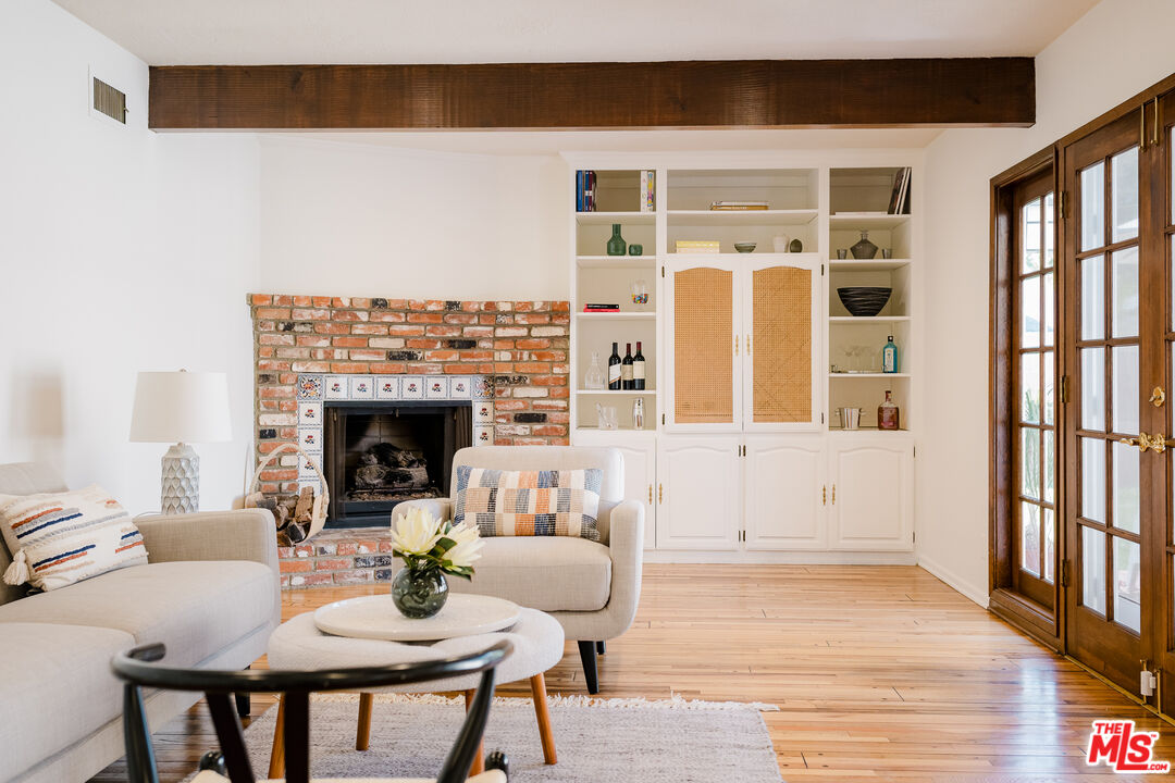 5849 Goodland Avenue Valley Village, CA 91607 - Photo 13 of 25 a living room with furniture fireplace and a large window