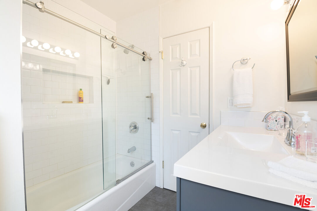 5849 Goodland Avenue Valley Village, CA 91607 - Photo 17 of 25 a bathroom with a shower and a sink