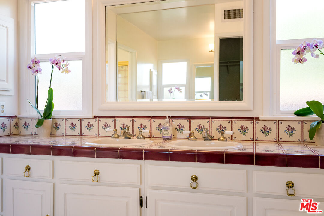 5849 Goodland Avenue Valley Village, CA 91607 - Photo 18 of 25 a bathroom with a bathtub and a sink