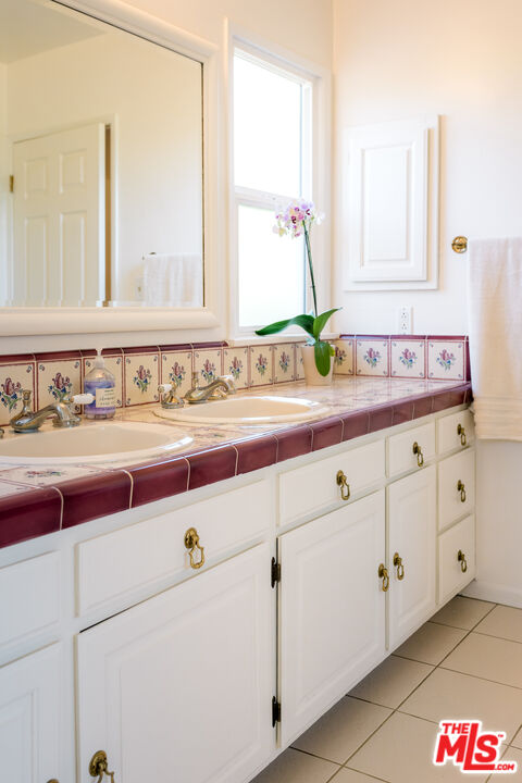 5849 Goodland Avenue Valley Village, CA 91607 - Photo 19 of 25 a bathroom with a sink and a mirror