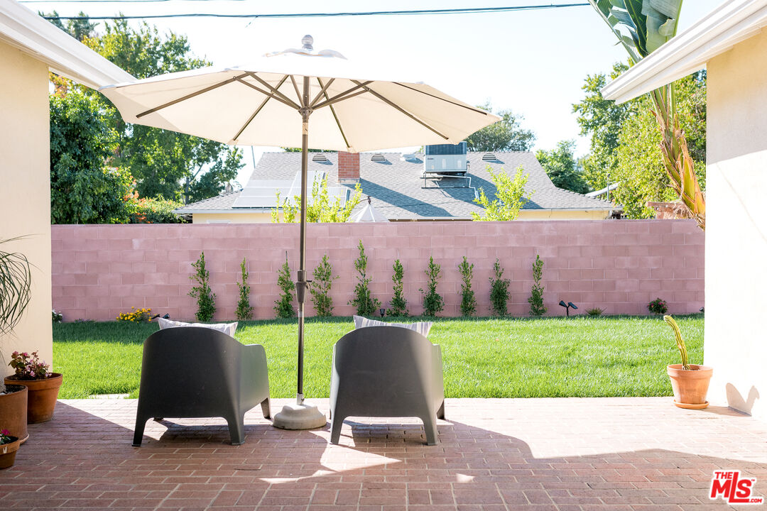 5849 Goodland Avenue Valley Village, CA 91607 - Photo 23 of 25 a view of a table and chairs in the garden