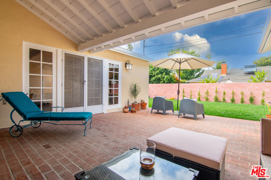 5849 Goodland Avenue Valley Village, CA 91607 - Photo 24 of 25 a backyard of a house with yard and outdoor seating