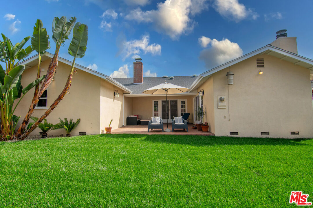 5849 Goodland Avenue Valley Village, CA 91607 - Photo 25 of 25 a view of a house with a yard and sitting area
