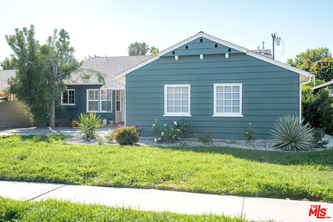 5849 Goodland Avenue Valley Village, CA 91607 - Photo 3 of 25 a front view of a house with a yard
