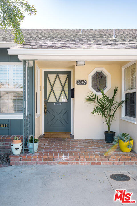 5849 Goodland Avenue Valley Village, CA 91607 - Photo 4 of 25 a front view of a house with garden