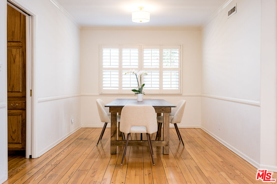5849 Goodland Avenue Valley Village, CA 91607 - Photo 10 of 25 a dining room with furniture and wooden floor