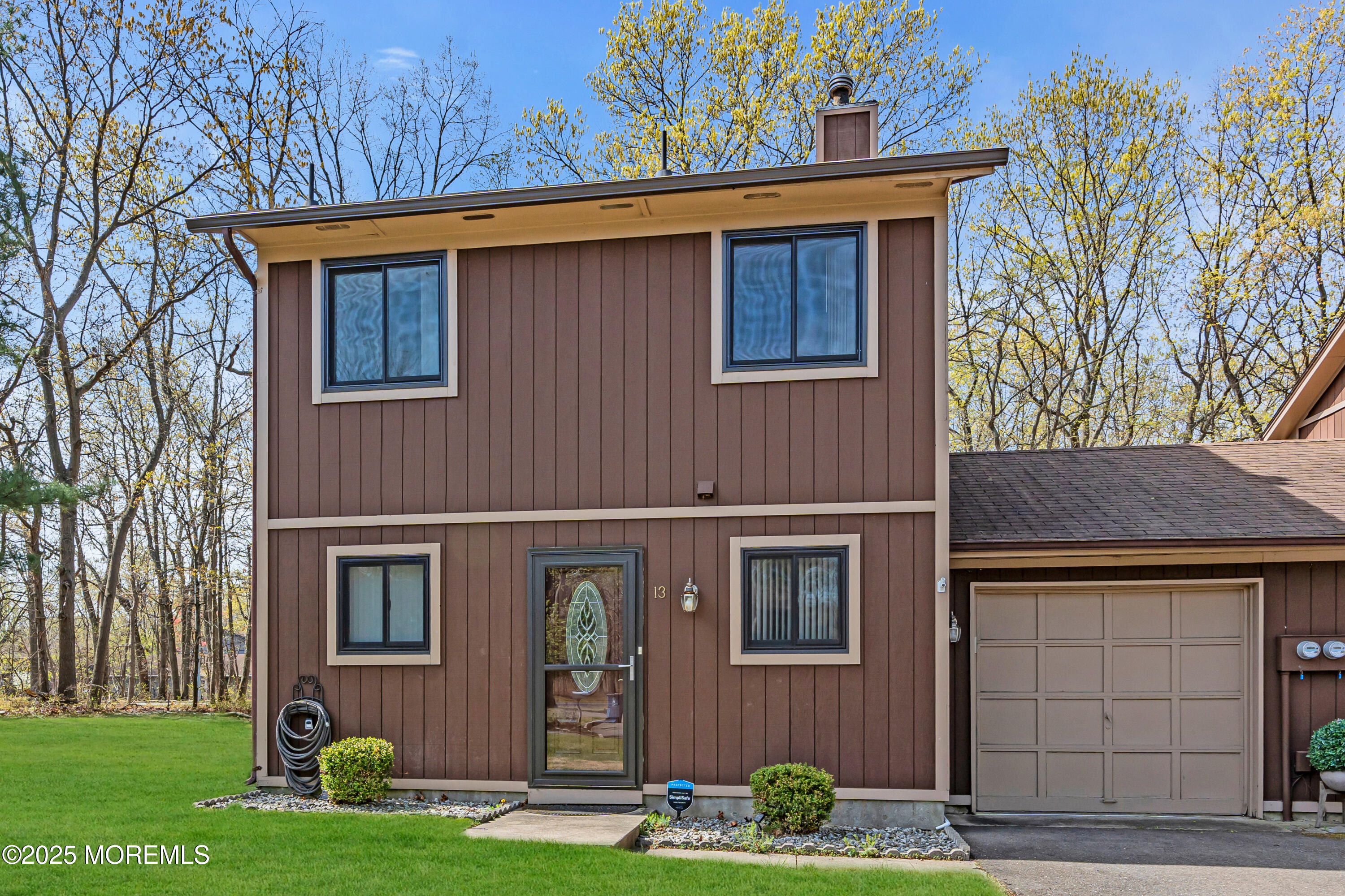 13 Owl Road, Unit 1000 Howell, NJ 07731 - Photo 3 of 39 a front view of a house with garden