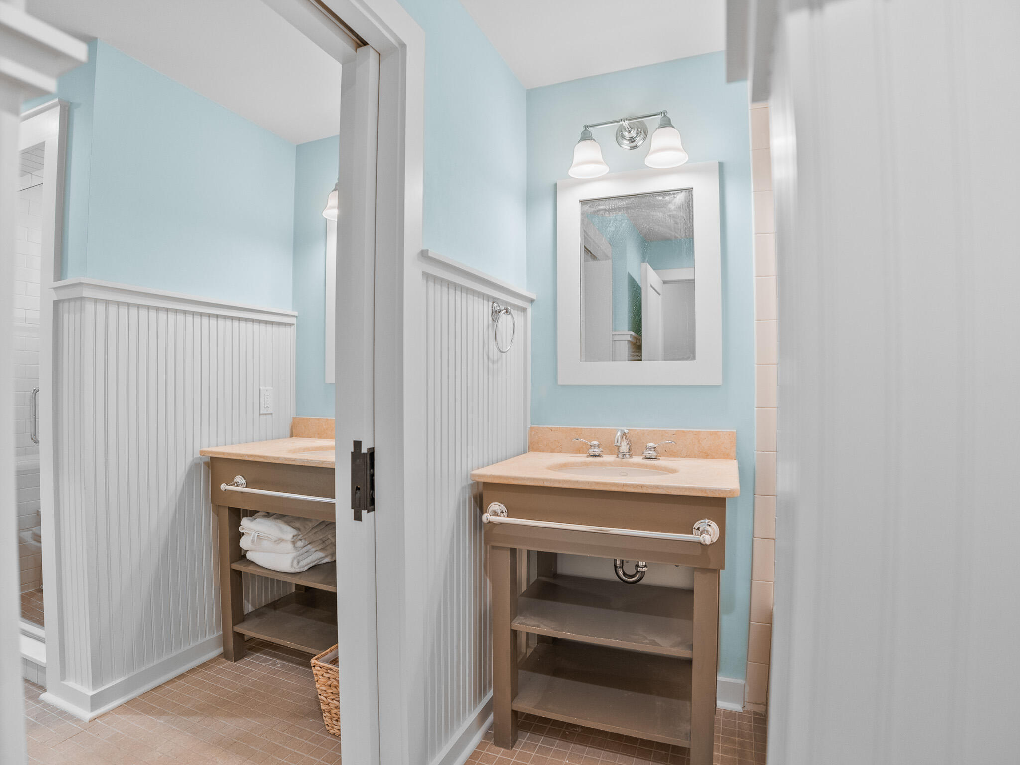 253 Salt Lane Watersound, FL 32461 - Photo 18 of 56 a room with a sink and a mirror