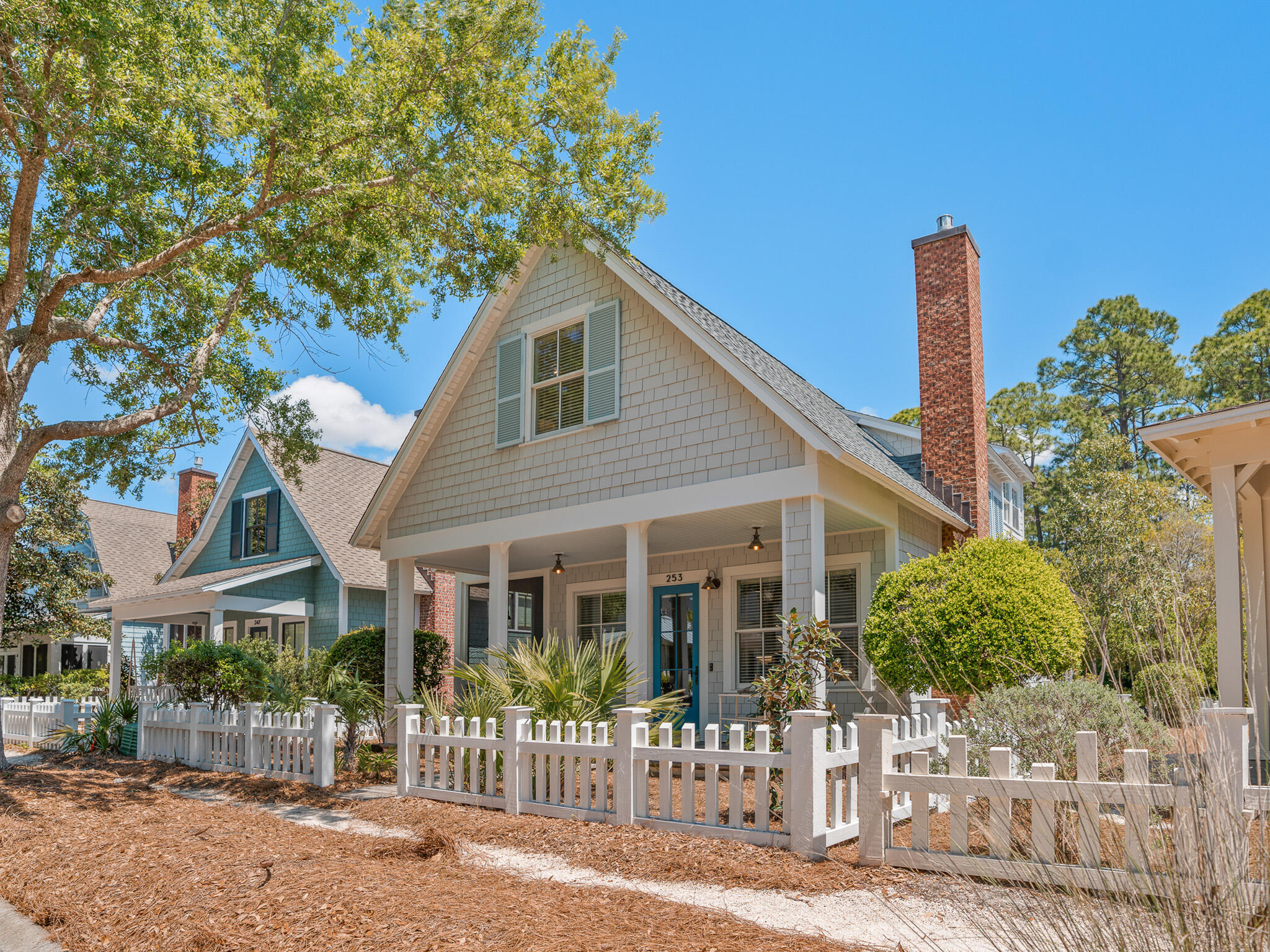 253 Salt Lane Watersound, FL 32461 - Photo 2 of 56 a front view of a house with a garden