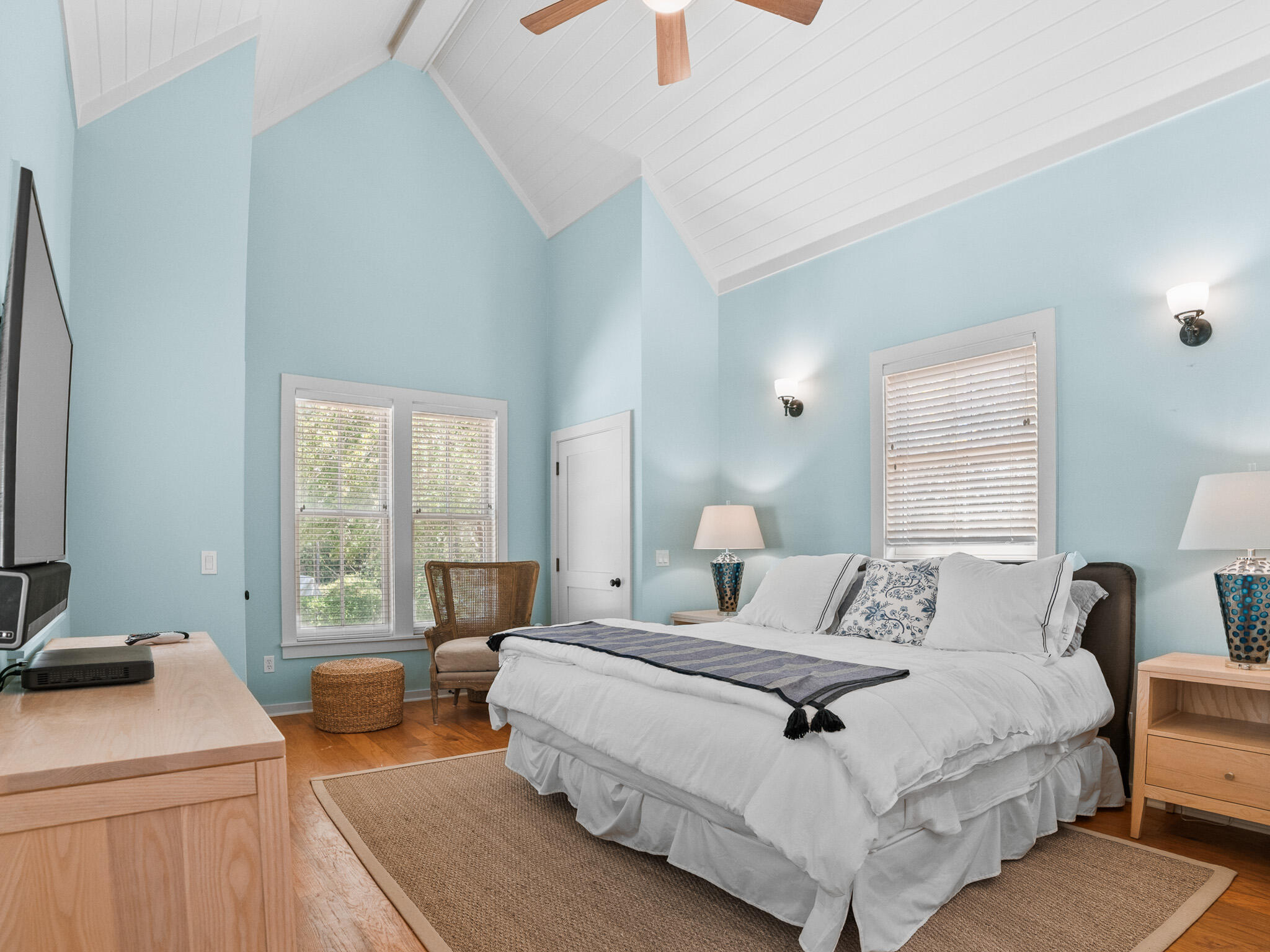 253 Salt Lane Watersound, FL 32461 - Photo 22 of 56 a bedroom with a bed and a table