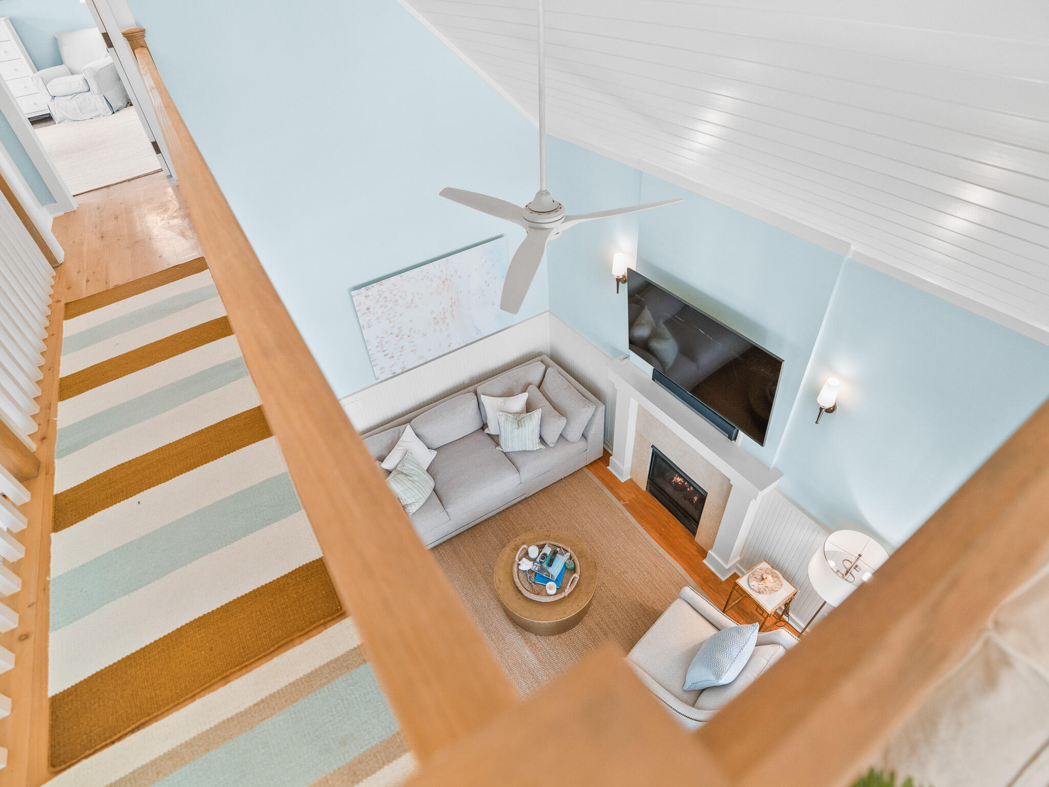 253 Salt Lane Watersound, FL 32461 - Photo 27 of 56 a living room with furniture and a flat screen tv