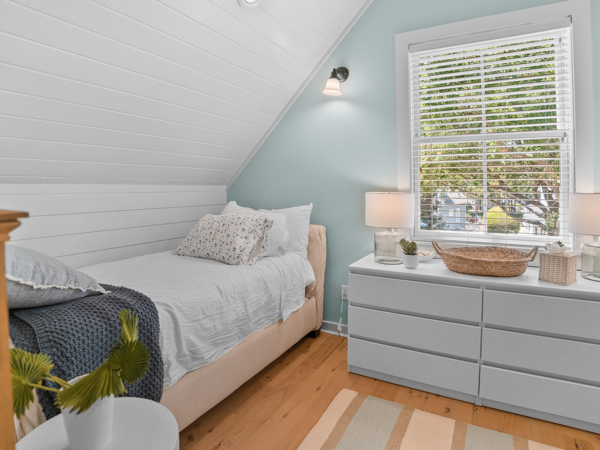 253 Salt Lane Watersound, FL 32461 - Photo 33 of 56 a bedroom with a bed and a window