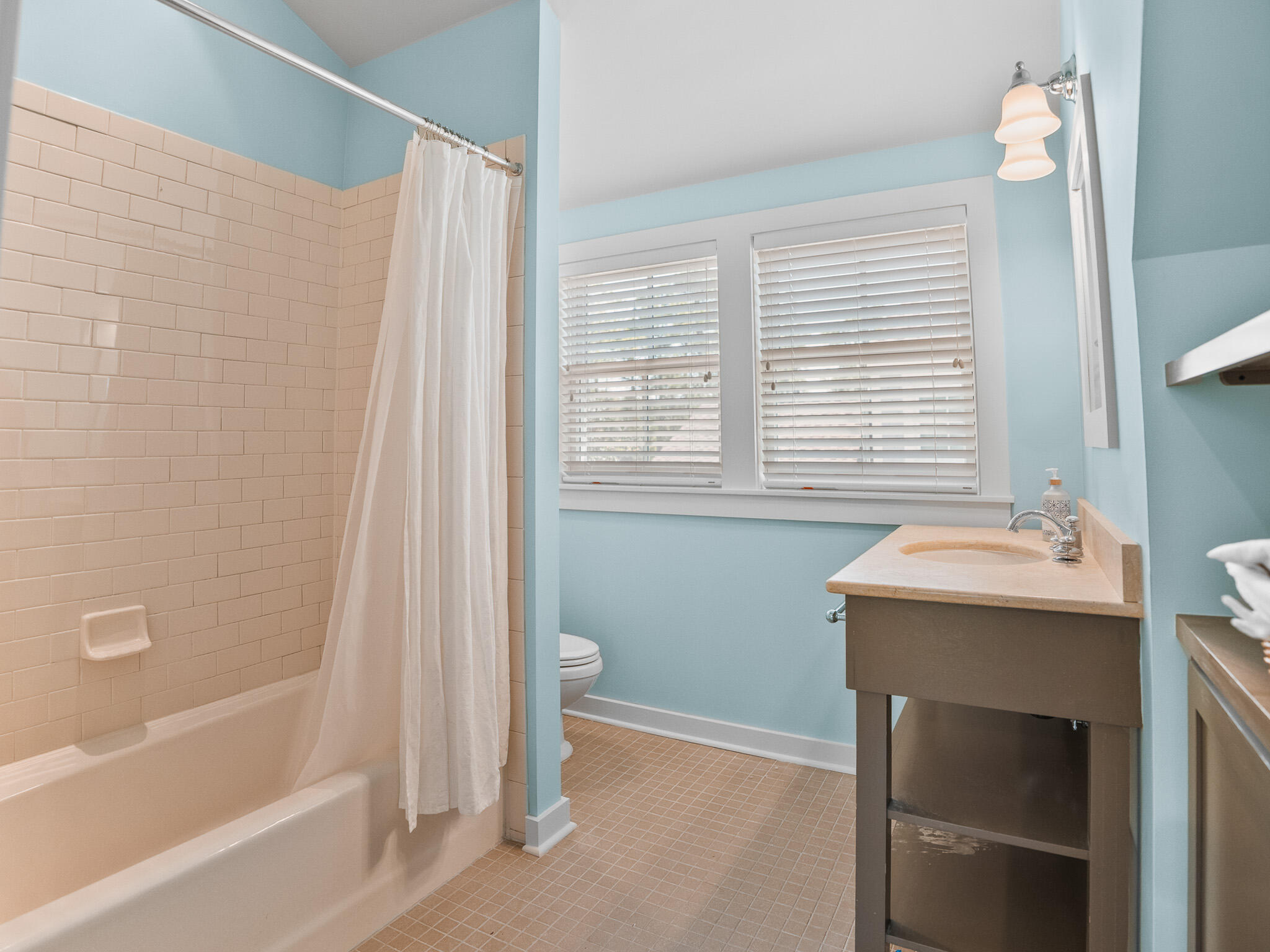 253 Salt Lane Watersound, FL 32461 - Photo 38 of 56 a bathroom with a sink a toilet and shower